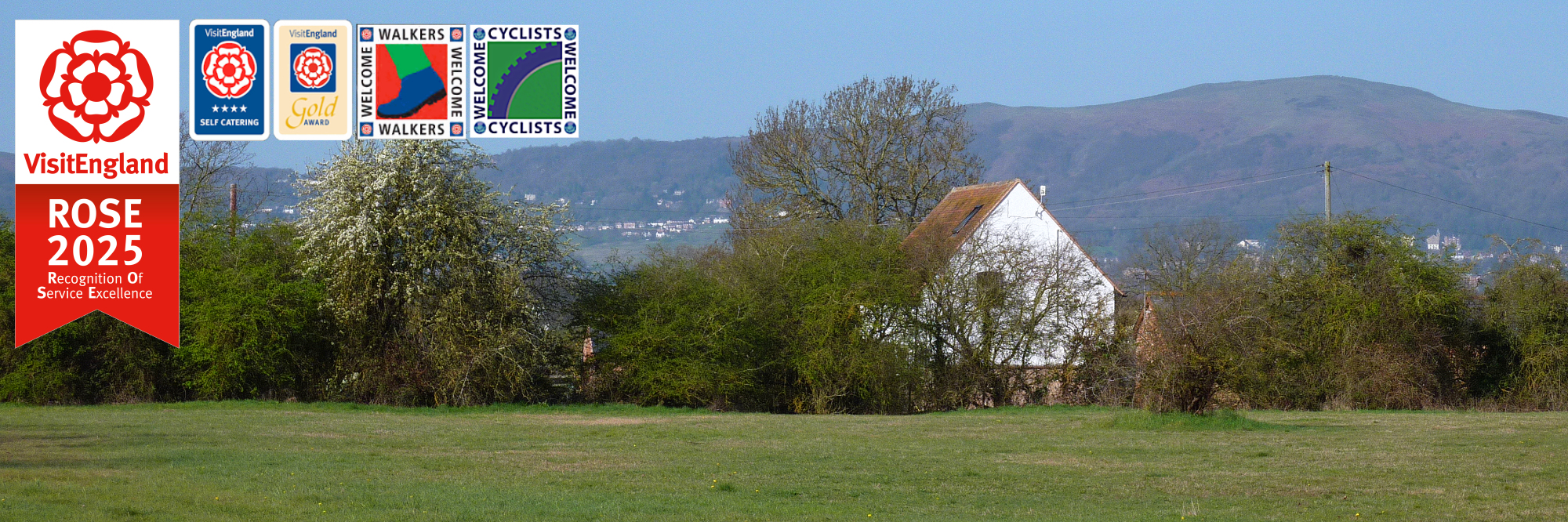 Rhydd Barn from east with Malvern Hills in background