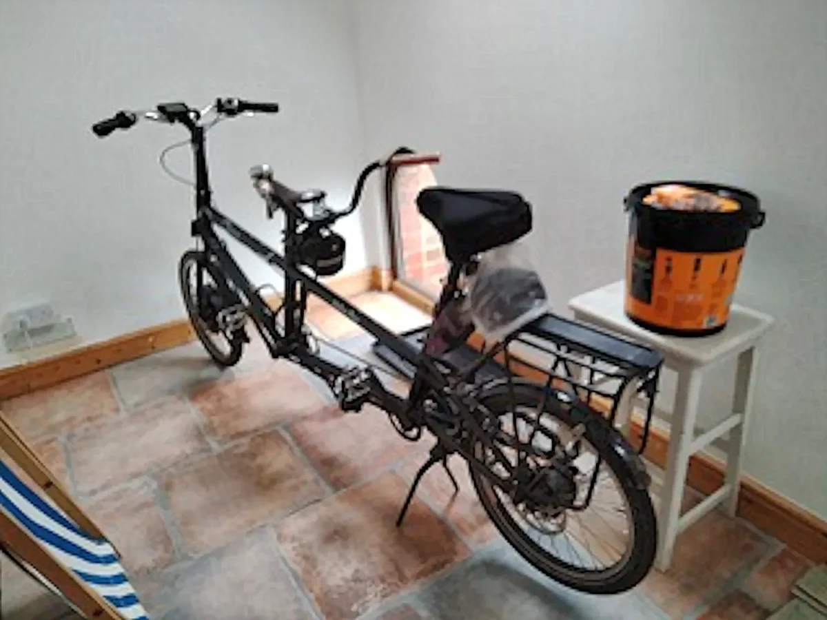 Tandem bicycle safely stored in the pigsty